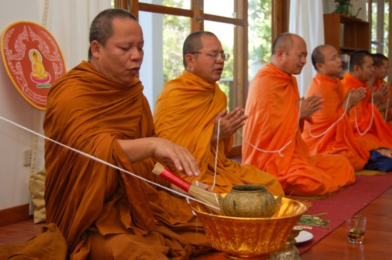 Thai monks at a house blessing ceremony