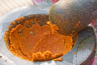 Curry paste in the mortar before the shrimp paste is added