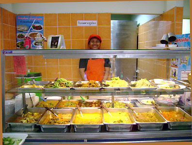 Numerous Thai curry dishes at the bus station