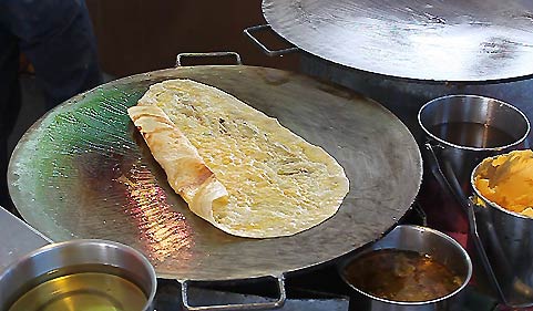 Thai-Style Roti on the griddle at a Southern Thai Food Festival in Thailand.