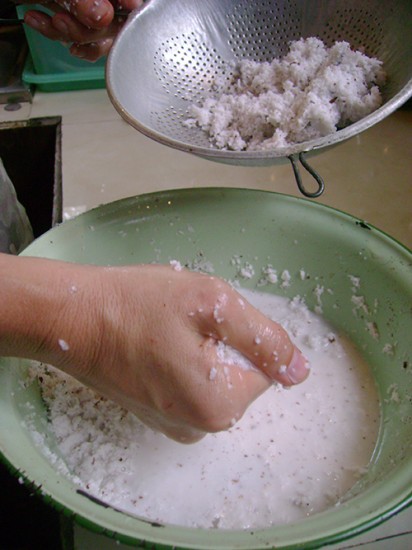 Straining the coconut meat